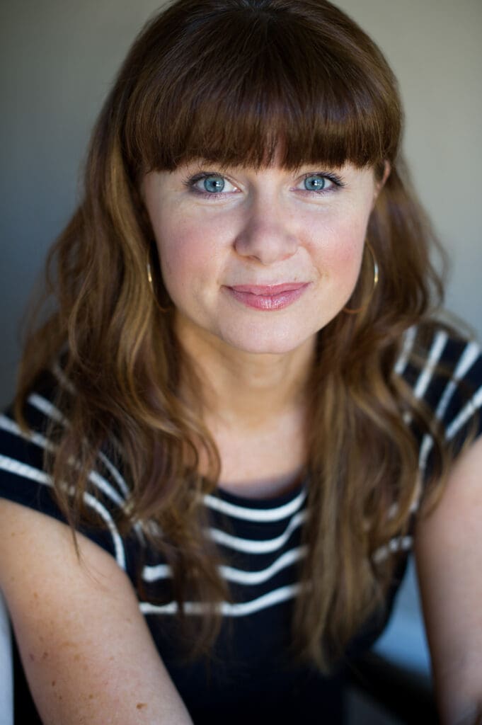 straight on close up acting headshot pose of female with brown hair
